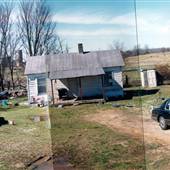 shack w/farm in background